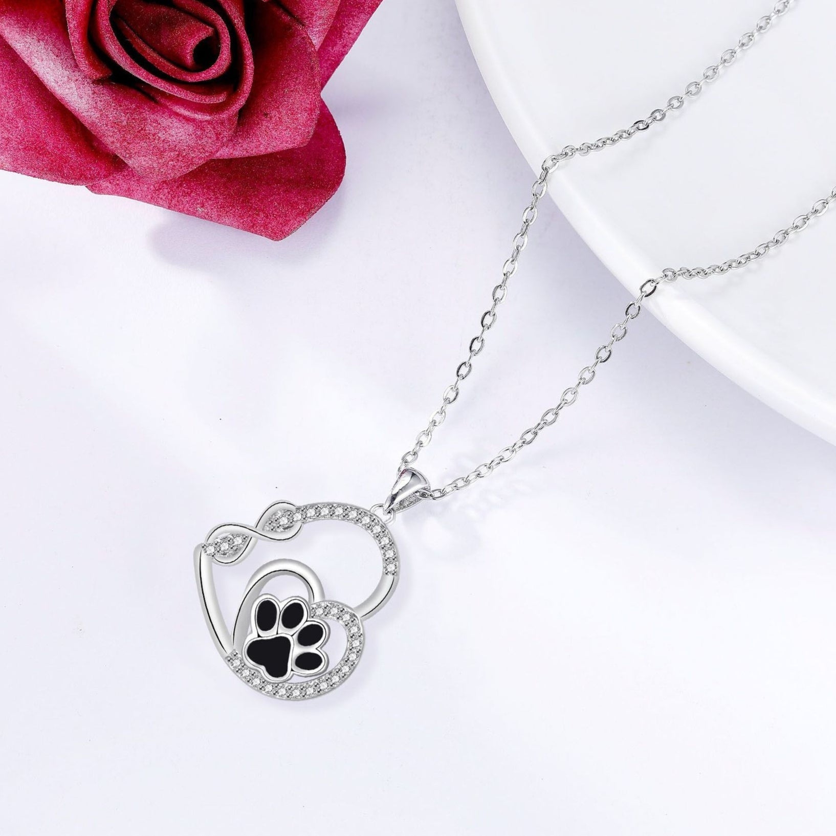 Pendentif en forme d'empreinte de patte de double amour éternel