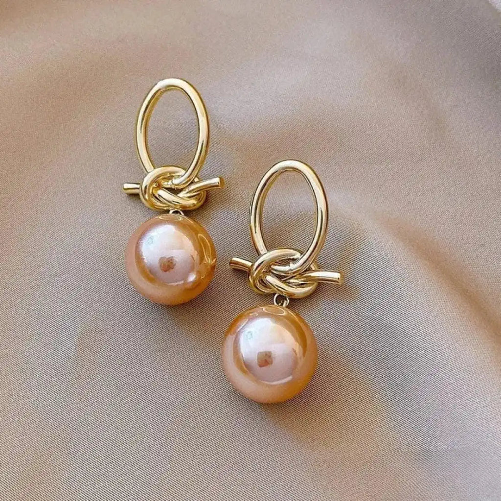 Boucles d'Oreilles en Perles Roses Élégantes